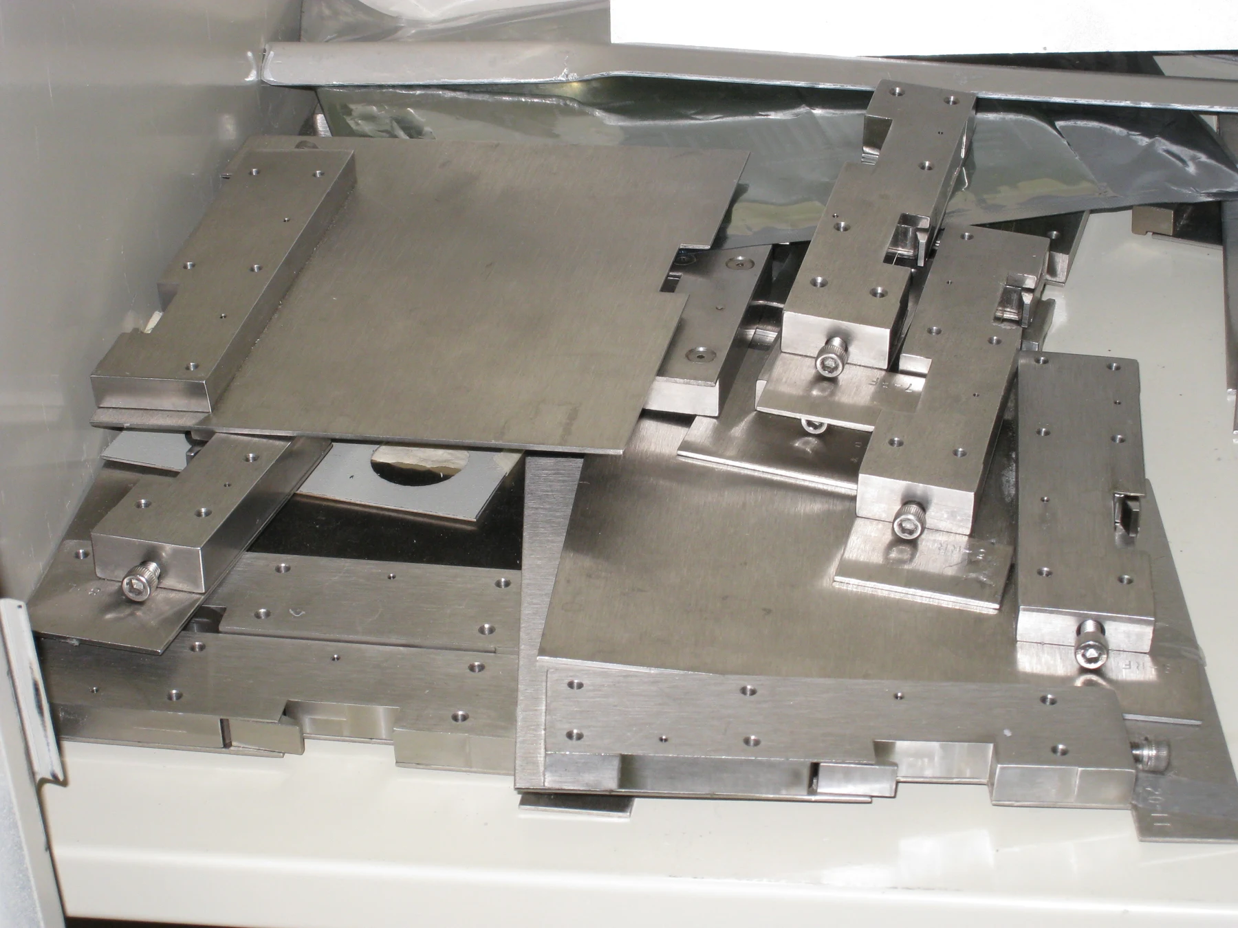 Sheet metal support plates and machined fixture blocks